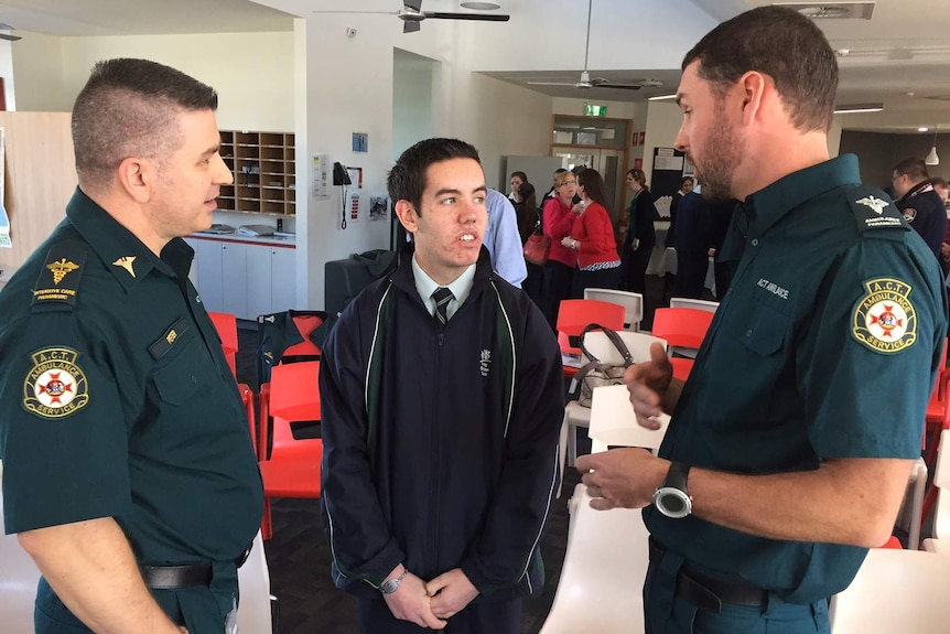 Thomas Rowsell meets the paramedics who arrived after he suffered a heart attack