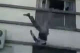 Body falling from roof in Syria