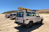 Three state emergency rescue vehicles parked on Maslin beach