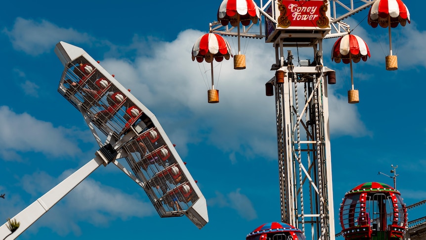 A red and white decorated fair ride.