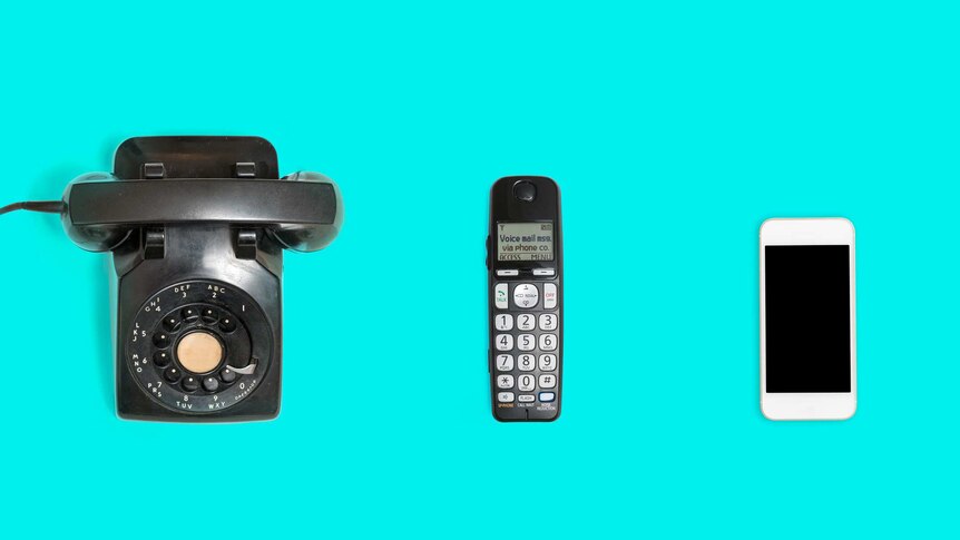A flat-lay shows different phones on a bright aqua background: a bell telephone, an early 2000s home handset, and a smartphone.
