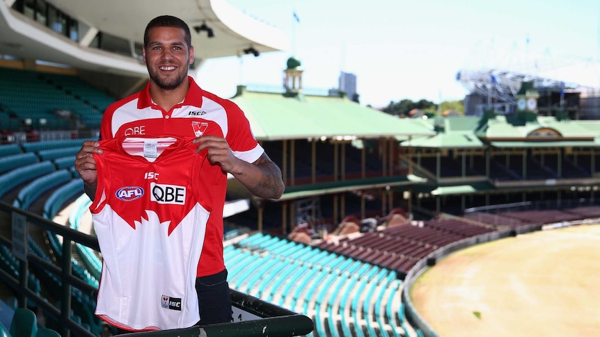 Lance Franklin shows off Swans jersey