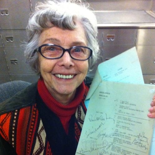Dawn Swane holds the original signed call sheet for The Music of Lennon & McCartney.