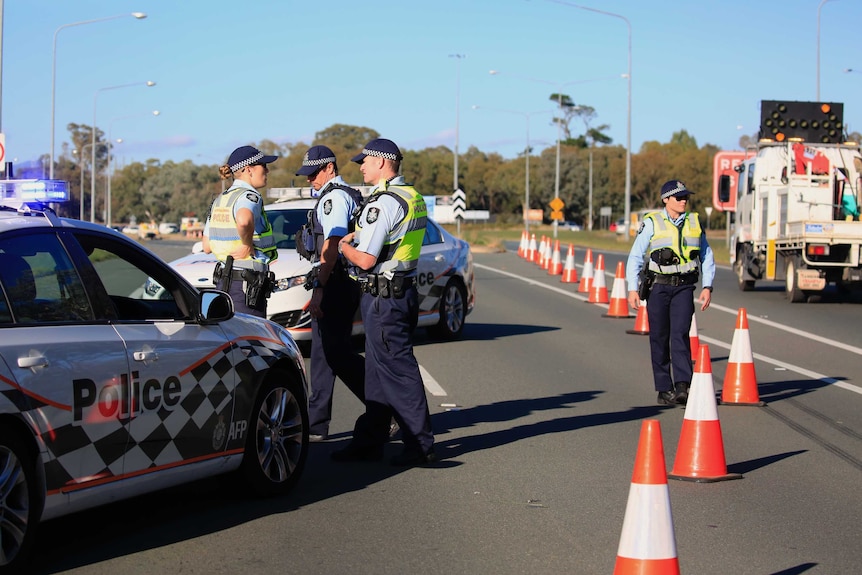 Police at the scene of the arrest of two teenagers on the Monaro Highway.
