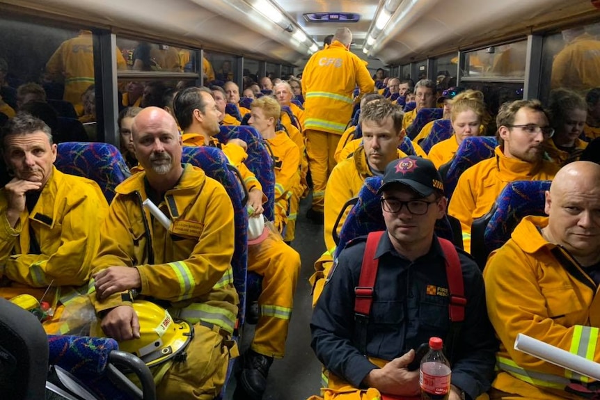 Firefighters pack a bus on Kangaroo Island.