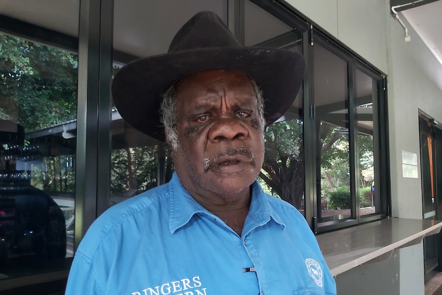 An older Indigenous man in a cowboy hat.