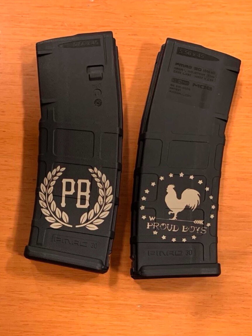 Two gun magazines with the PB Proud Boys logo on a table