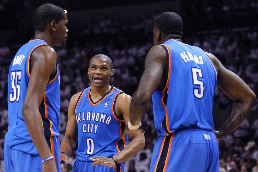 Oklahoma City Thunder's Kevin Durant (L), Russell Westbrook (C) and Kendrick Perkins in June 2012.