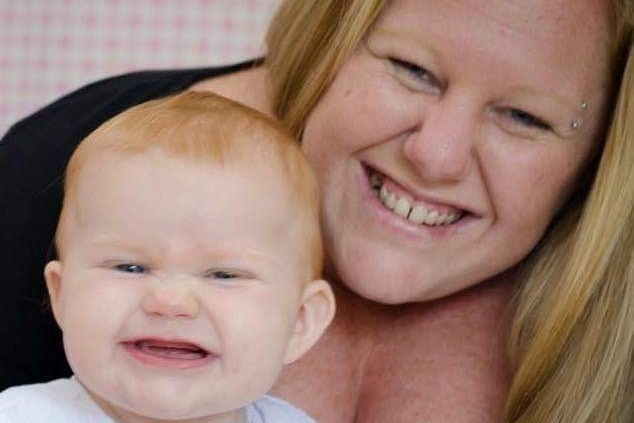 Michelle Ross smiles with her baby Jessica
