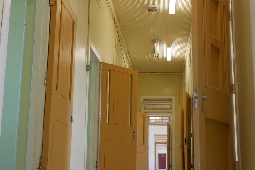 An interior photo of doors and rooms inside the old Sandy Gallop Asylum at Ipswich, west of Brisbane,