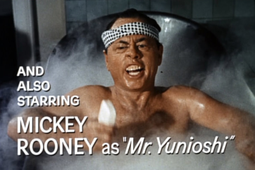 Mickey Rooney in a bathtub dressed as Mr Yunioshi in film Breakfast at Tiffany's.