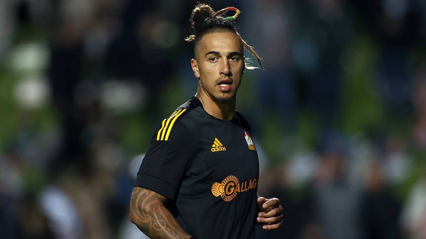 A New Zealand Chiefs rugby union player warms up before a match against the NSW Waratahs in Sydney in 2021.