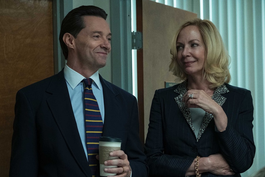 Hugh Jackman and Allison Janney the film Bad Education, both in office clothes in a dreary office