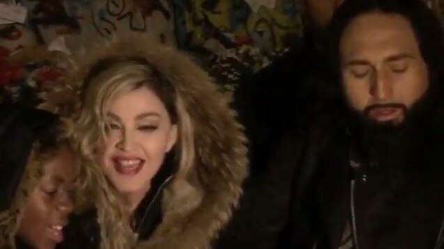 Madonna sings John Lennon's Imagine with her son David and her guitarist Monte Pittman.