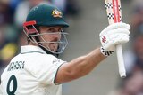 Australia batter Mitch Marsh raises his bat during the MCG Test.
