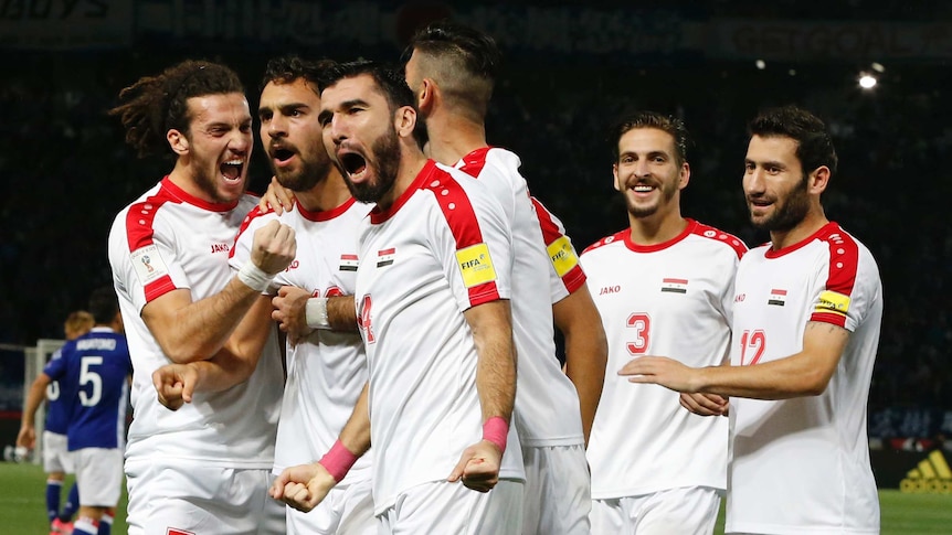 Syria celebrates goal against Japan