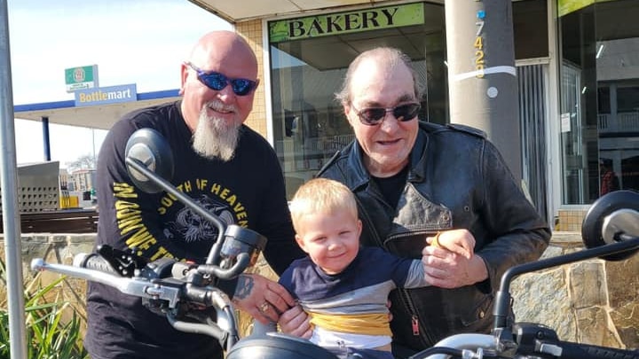 Jarah on a motorbike with Crackers and Terry GIbson. I'm not crying, you're crying.