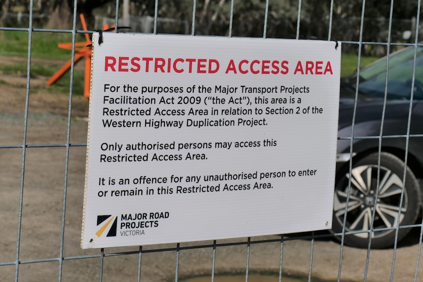 A sign says restricted access area