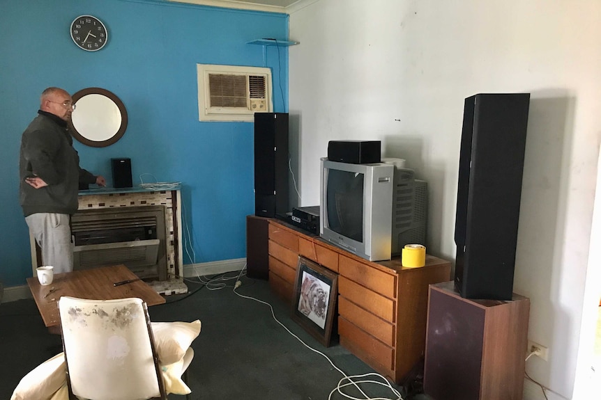 Arthur Johnson looks at an old fashioned solid television and stereos.