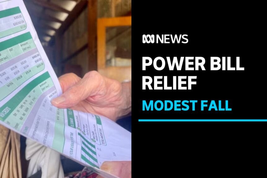 Power Bill Relief, Modest Fall: Close up of someone holding an energy bill.