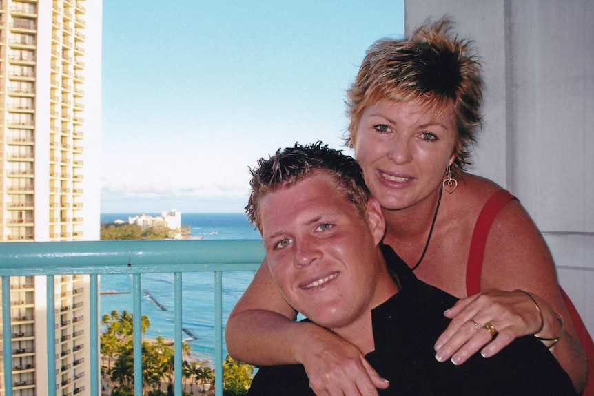Mother and son pose for photo on a Gold Coast balcony.