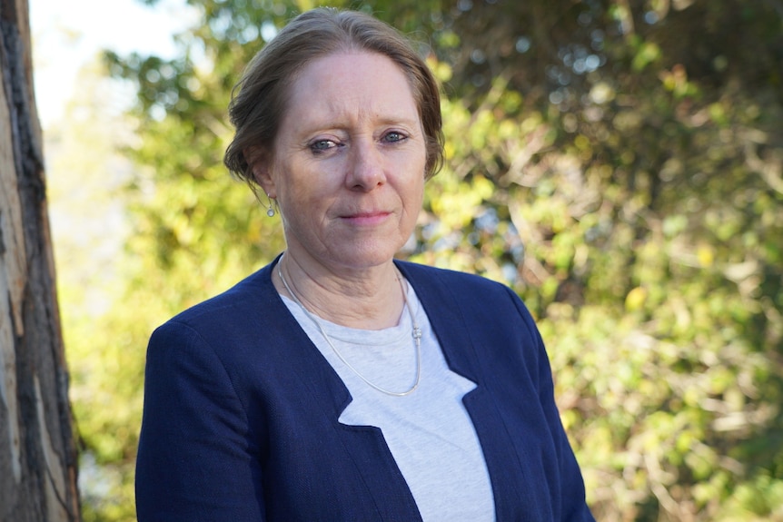 Professor Fran Sheldon stands under a tree.