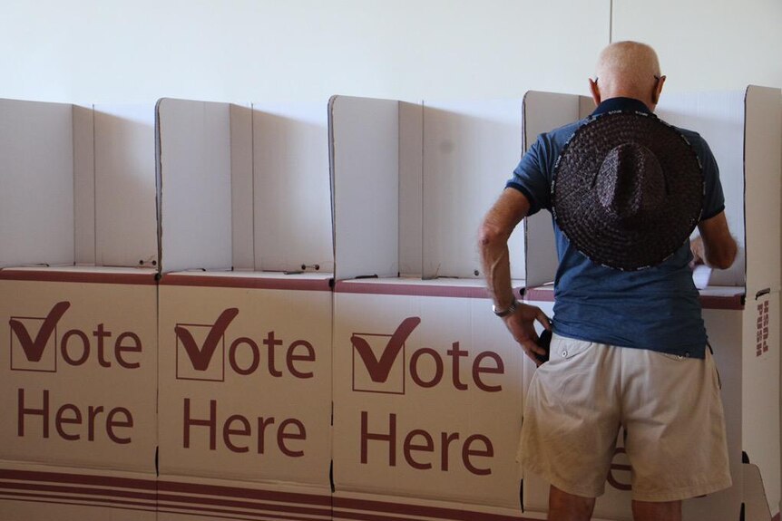 A Queenslander casts his vote in the January 31, 2015, state election.