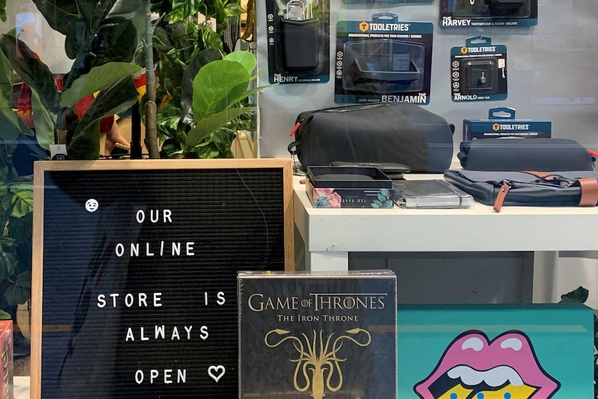 A sign in a shop window in Newtown, Sydney reading "our online store is always open"