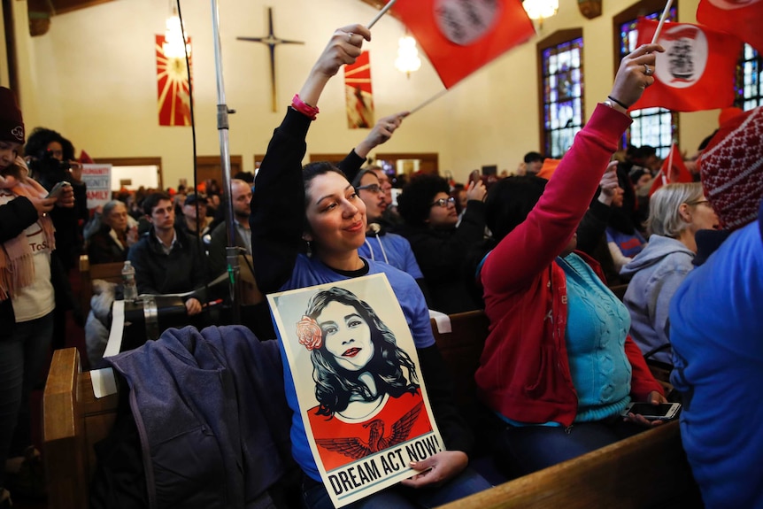 Activists wave flags inside a church.