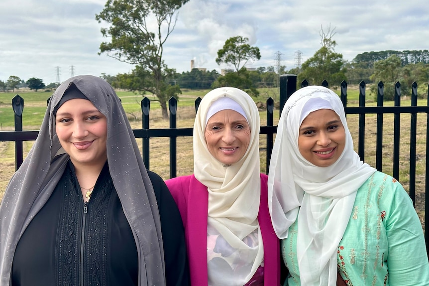 three women looking at camera