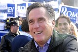 Mitt Romney greets voters outside a polling station in Manchester, New Hampshire