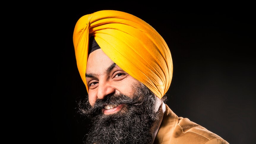 Photograph of Tejpartap Singh wearing yellow turban and long beard with curled moustache.