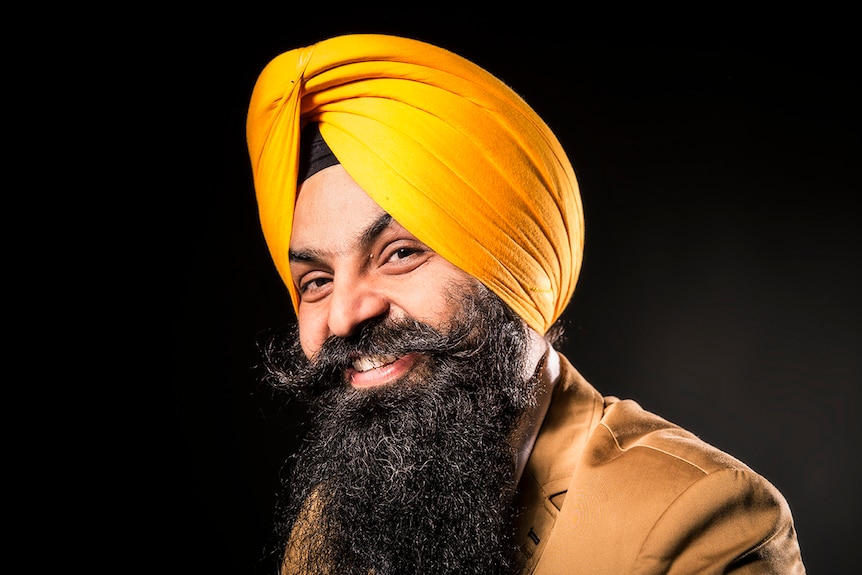 Photograph of Tejpartap Singh wearing yellow turban and long beard with curled moustache.