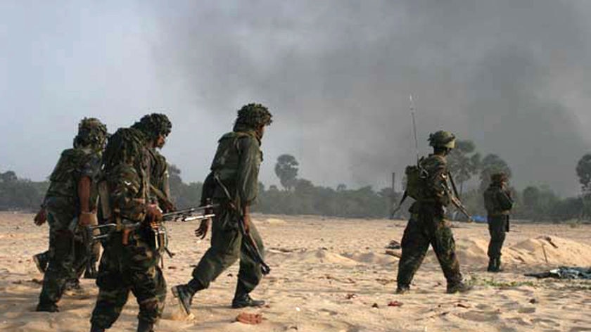 Sri Lankan soldiers advance during the civil war with the Tamil Tigers.