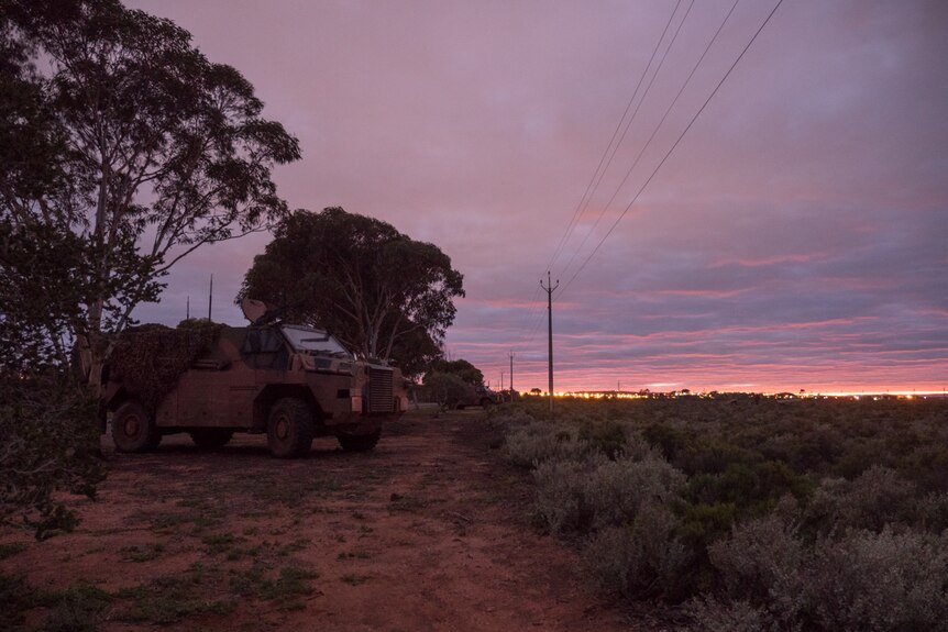 Soldiers in Bushman vehicles protecting the boundaries of the Whyalla airport.