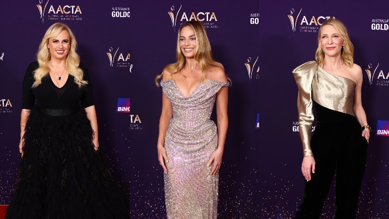 Three actresses standing on the red carpet