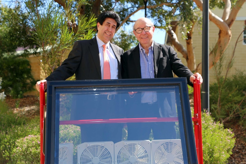 Kamal Alameh and Victor Rosenberg with one of their energy harvesting glass panels.