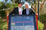 Kamal Alameh and Victor Rosenberg with one of their energy harvesting glass panels.
