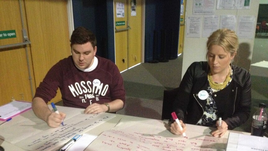 Volunteers record ideas at a youth employment forum in Launceston