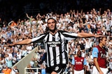Happy homecoming: Newcastle's Andy Carroll celebrates a hat-trick at St James' Park.