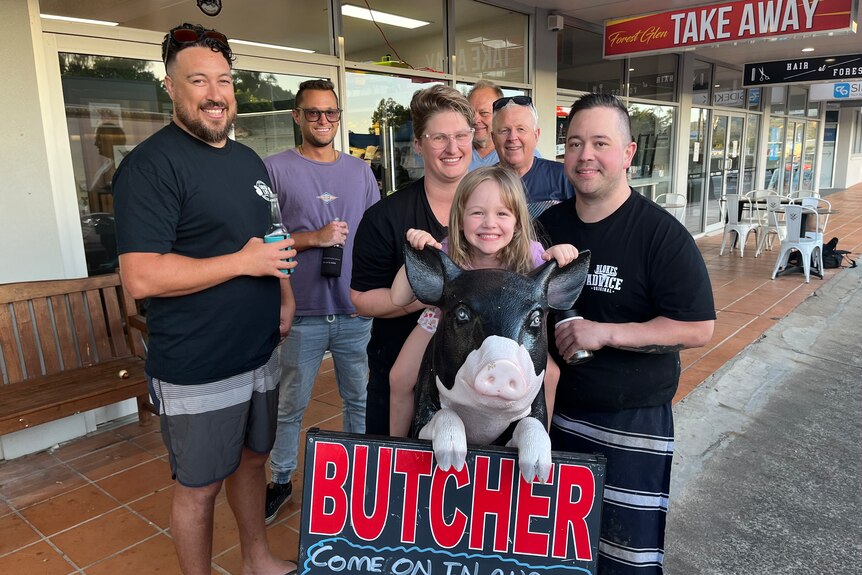 Brenton Harris, butcher and owner of the Original Forest Glen Butchery standing by a barbecue out the front of his shop