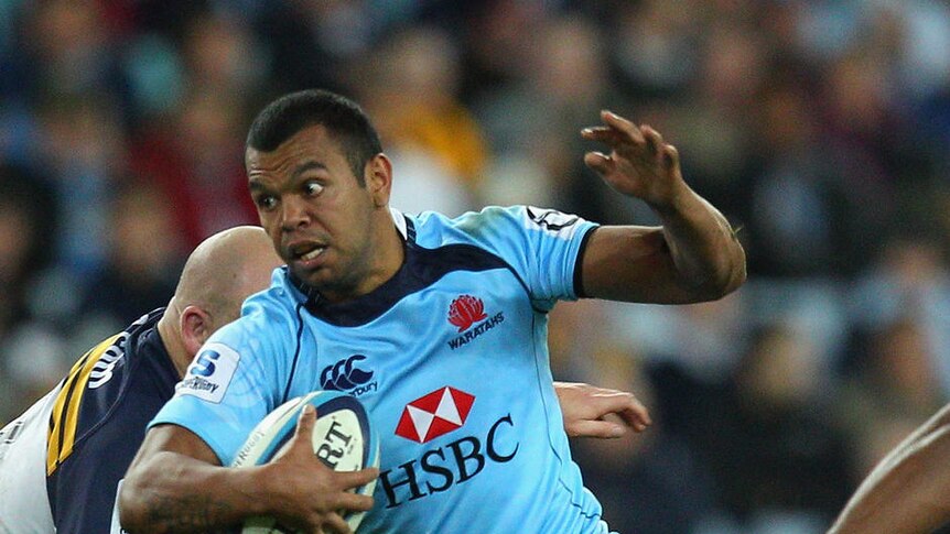 Kurtley Beale makes a break for the Waratahs during the rout.