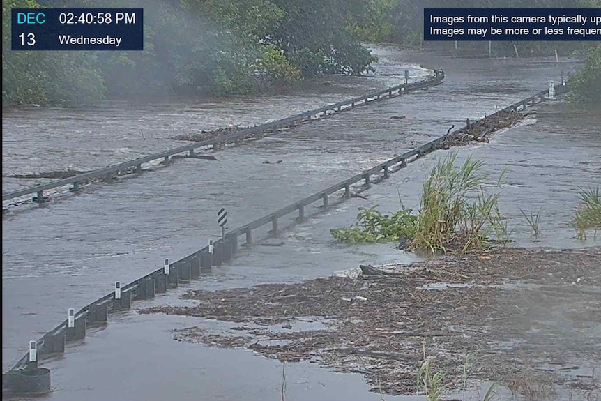 Floodwaters rising at Peets Bridge south of Cairns
