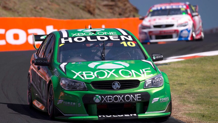 The car driven by Andy Priaulx and Mattias Ekstrom races down the mountain during the Bathurst 1000.