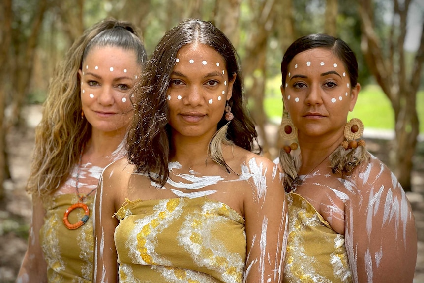 Three women in traditional dress.