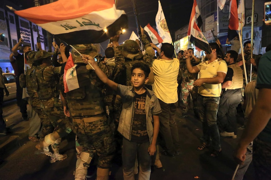 Iraqi security and civilians celebrate in Basra