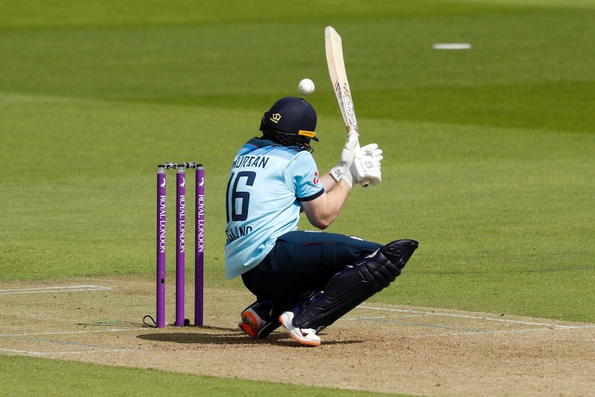 Eoin Morgan ducks under a short ball with his bat in the air