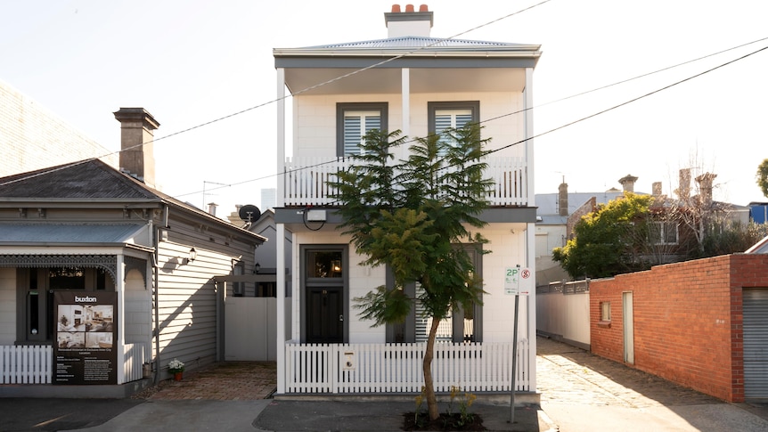 A white double-storey house in South Melbourne.