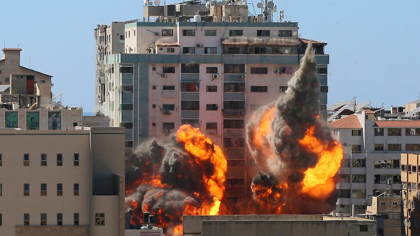 The al-Jalaa building used by AP and Al Jazeera in flames after being hit by an Israeli strike.