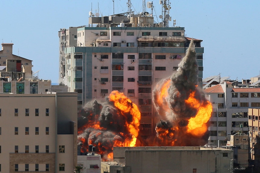 The al-Jalaa building used by AP and Al Jazeera in flames after being hit by an Israeli strike.